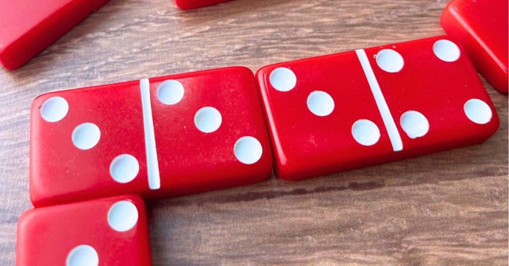 Guide To Beginner Dominoes Guide To Beginner Dominoes red domino game on a tabletop