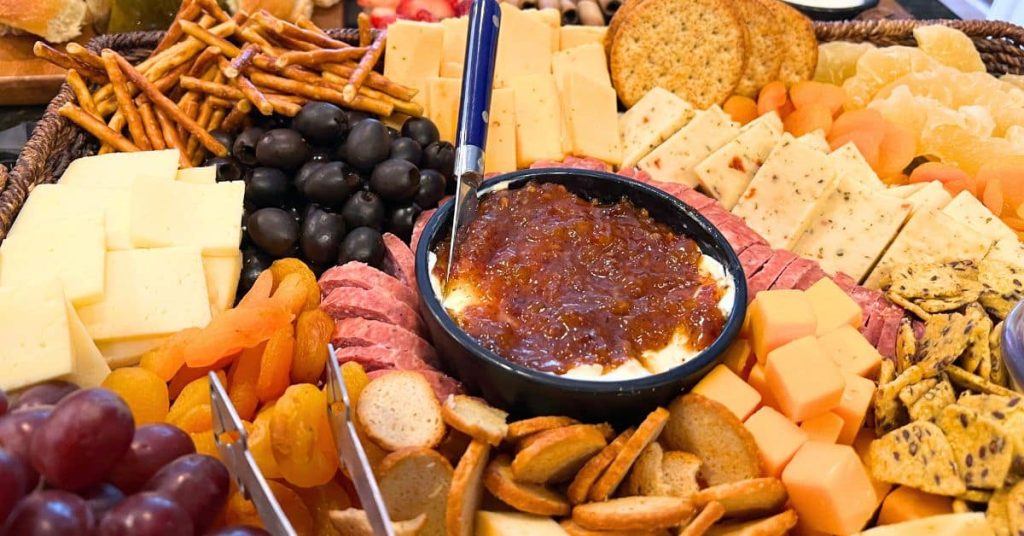 Easy Game Night Graze Board Easy Game Night Graze Board - different meats, cheeses, dips, fruits and vegetables and crackers on a snack board for a game night party or family game night foods